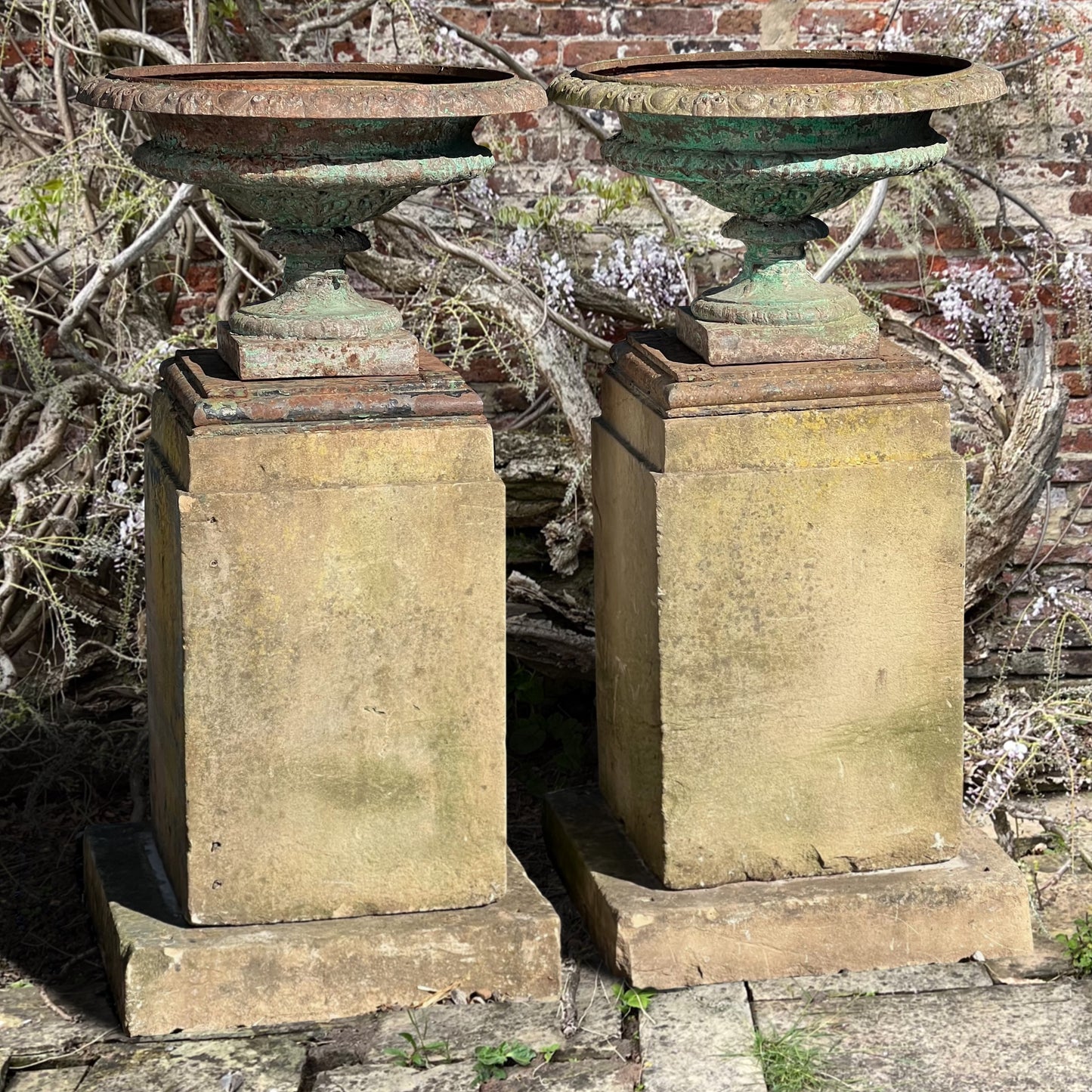 Pair of French Cast Iron Tazza Urns on Sandstone Plinths c.1880