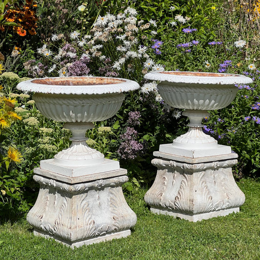 Pair of English Victorian Cast Iron Garden Urns on Ornamented Bases
