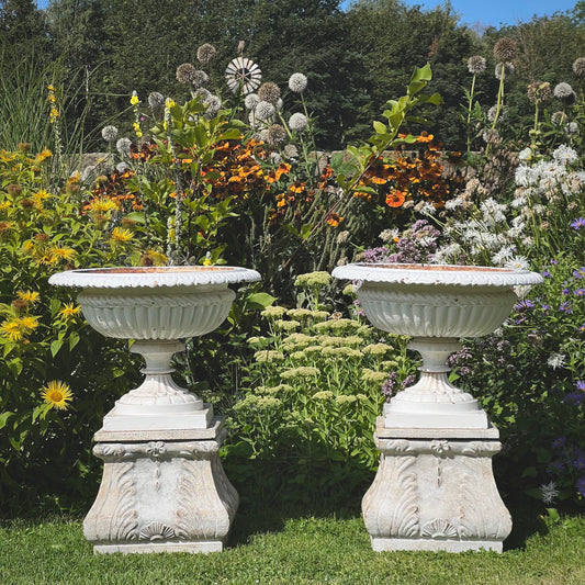 Pair of English Victorian Cast Iron Garden Urns on Ornamented Bases