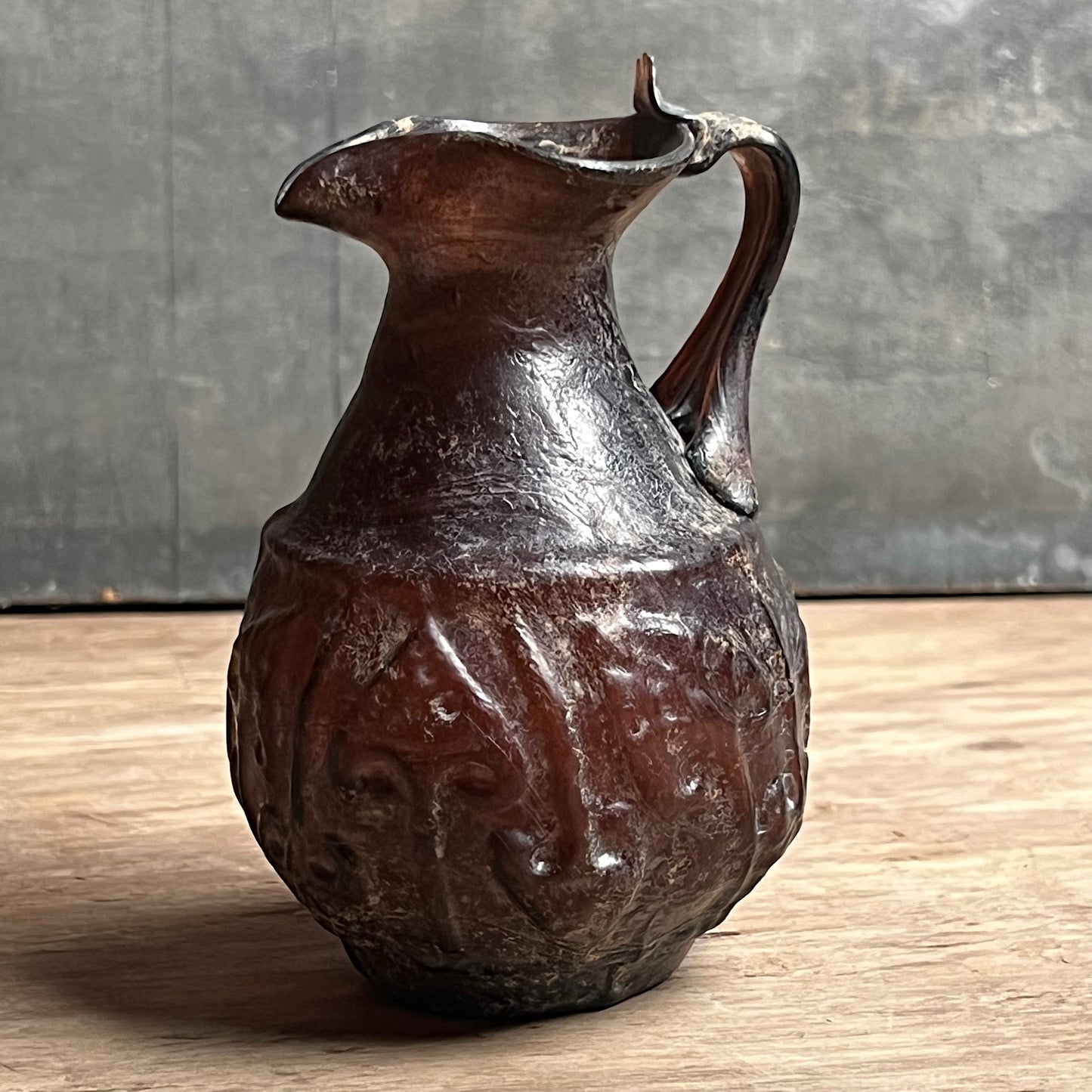 A Roman Aubergine Glass Trefoil-Lipped Jug c. 1st Century A.D.