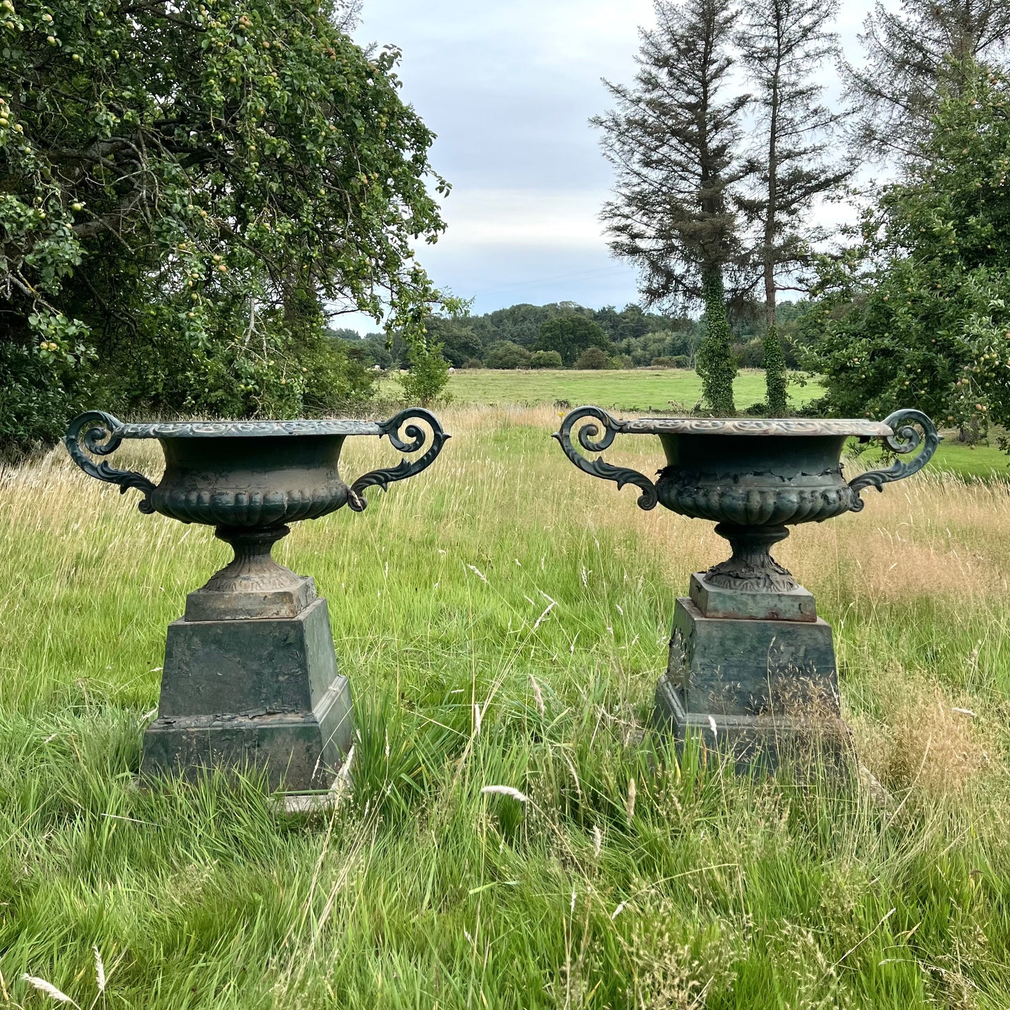 Pair of English Cast Iron Garden Urns with Plinths c.1870