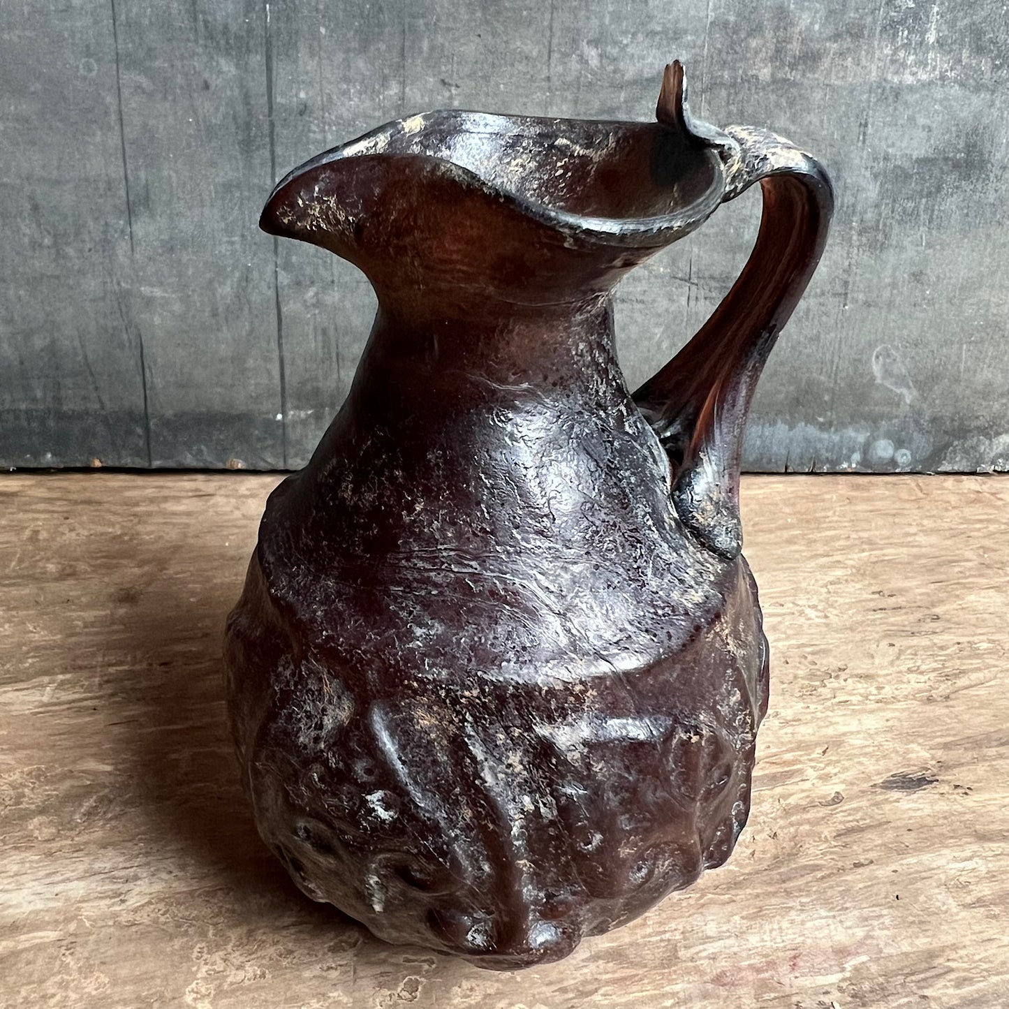 A Roman Aubergine Glass Trefoil-Lipped Jug c. 1st Century A.D.