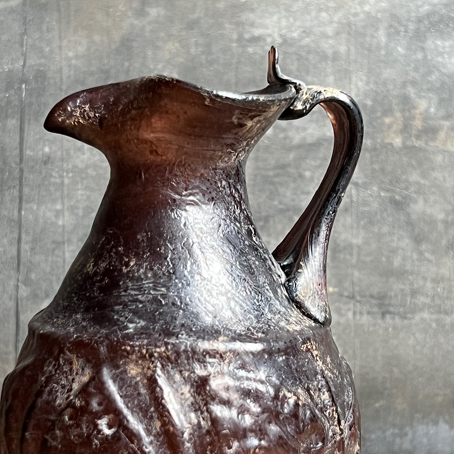 A Roman Aubergine Glass Trefoil-Lipped Jug c. 1st Century A.D.