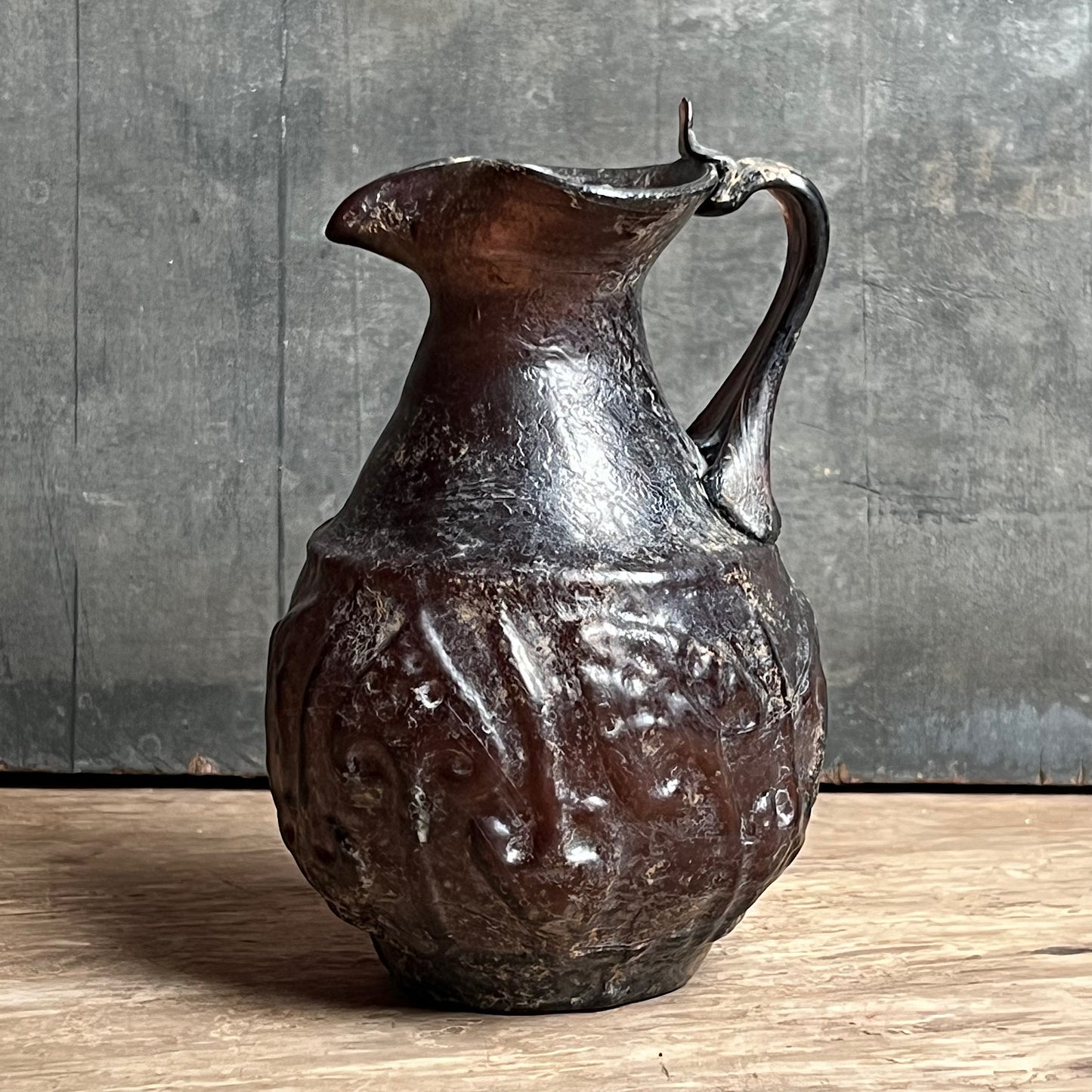 A Roman Aubergine Glass Trefoil-Lipped Jug c. 1st Century A.D.