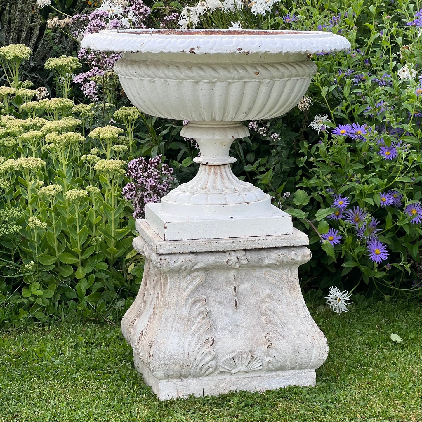 Pair of English Victorian Cast Iron Garden Urns on Ornamented Bases