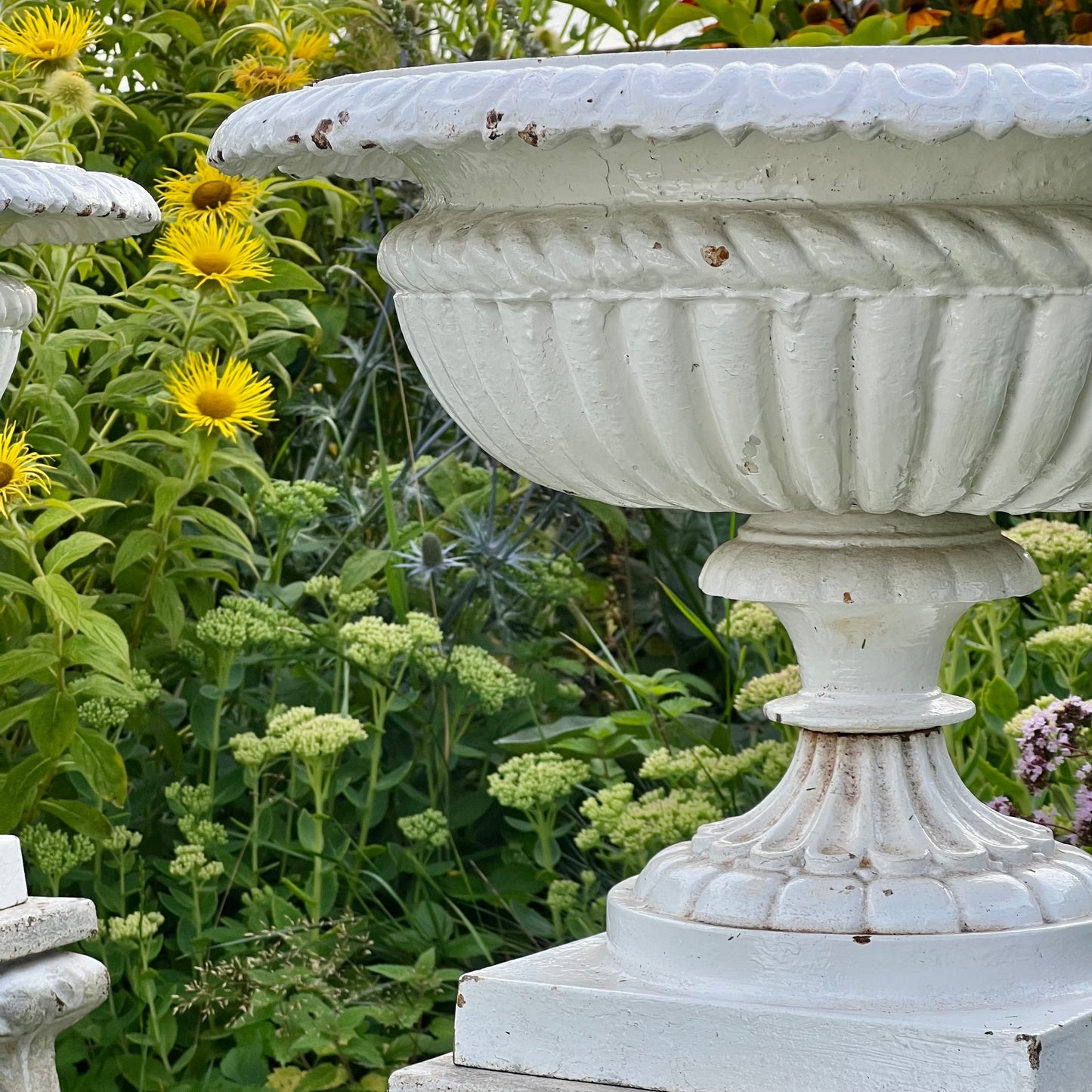 Pair of English Victorian Cast Iron Garden Urns on Ornamented Bases