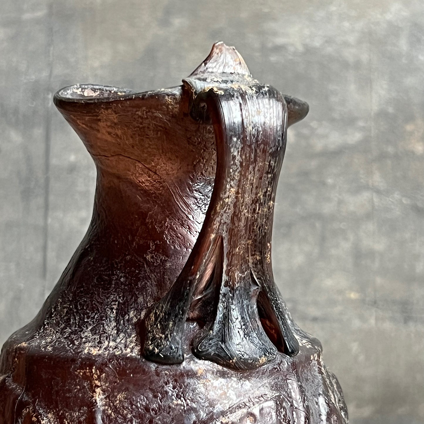 A Roman Aubergine Glass Trefoil-Lipped Jug c. 1st Century A.D.