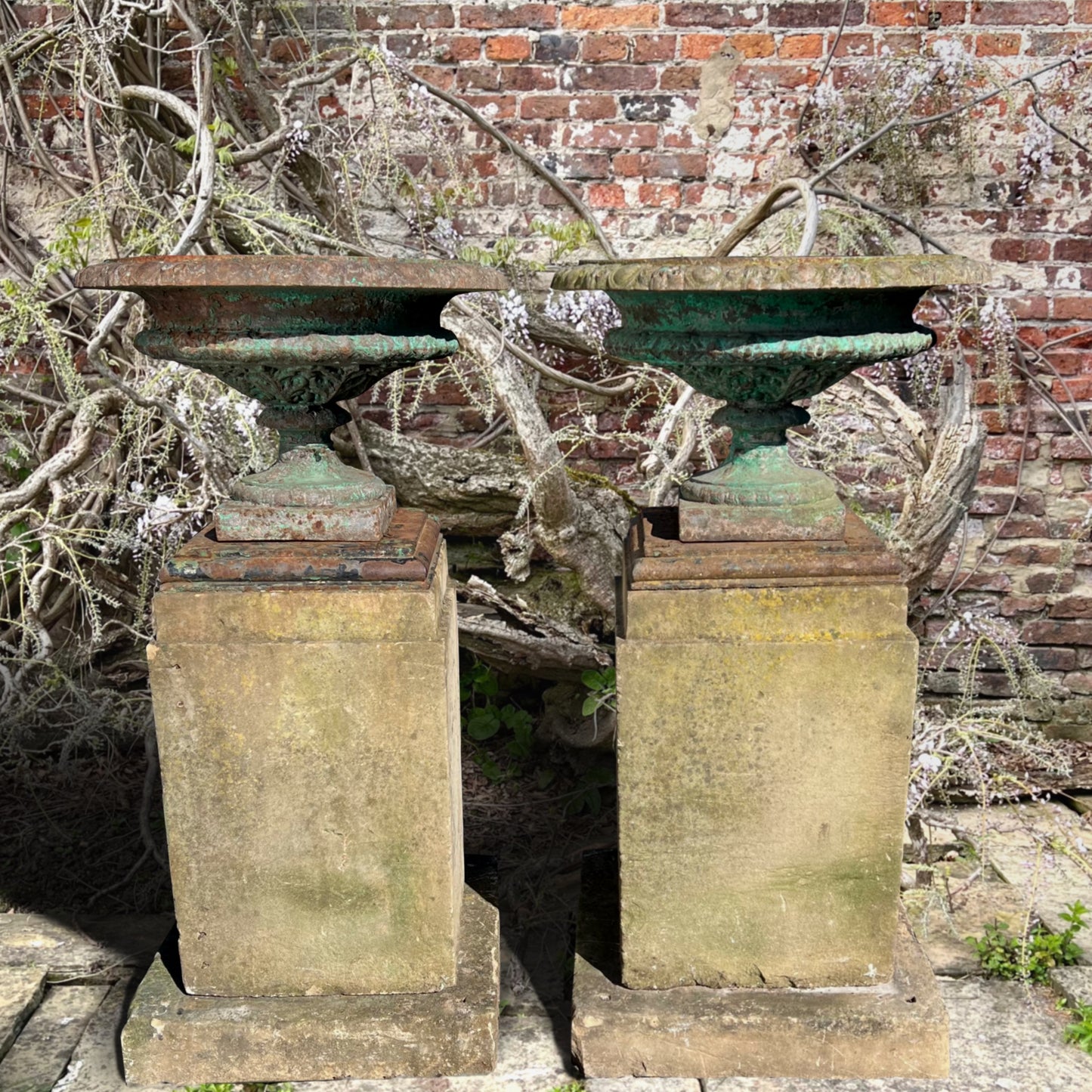 Pair of French Cast Iron Tazza Urns on Sandstone Plinths c.1880