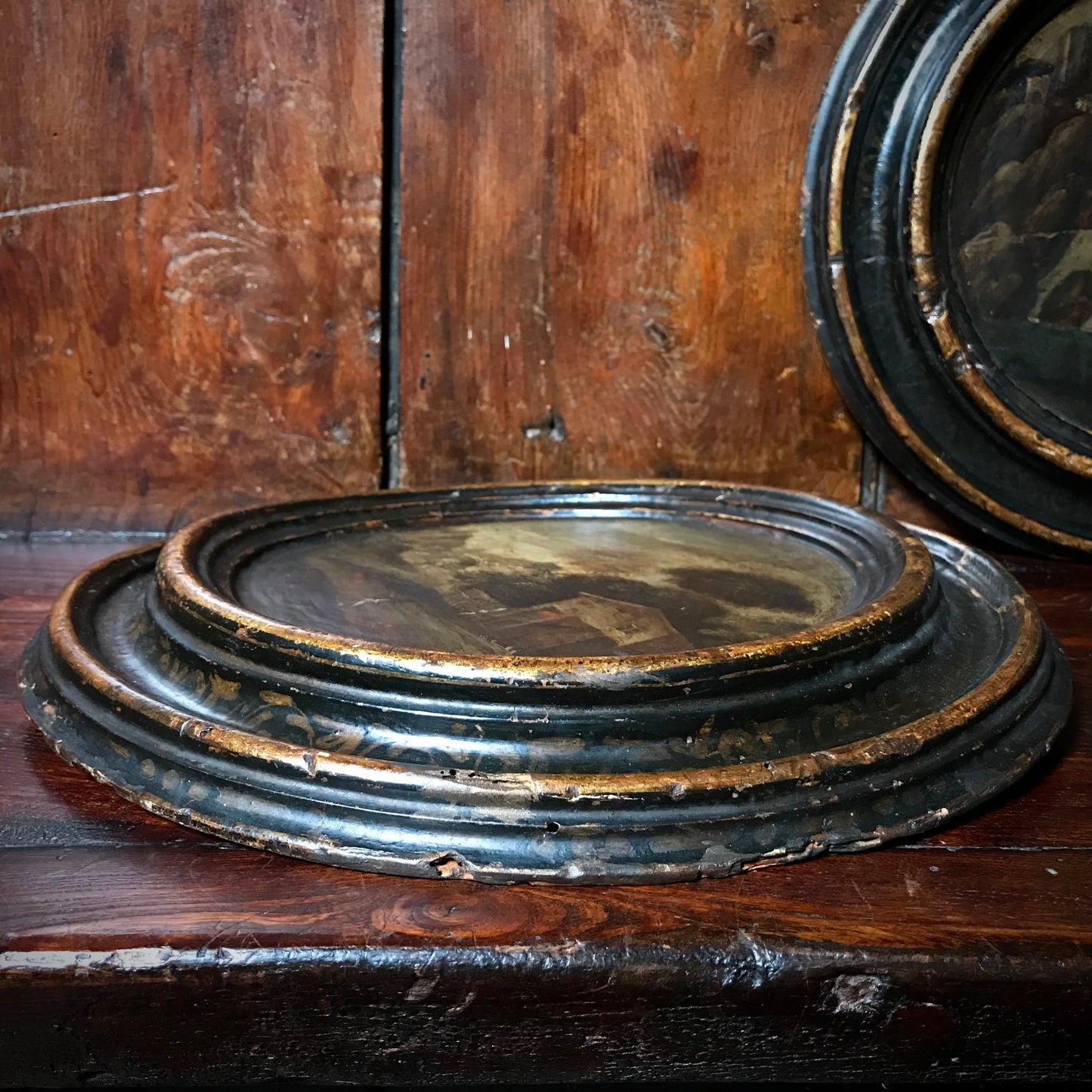A Pair of Italian School Ebonised Tondos c.1740