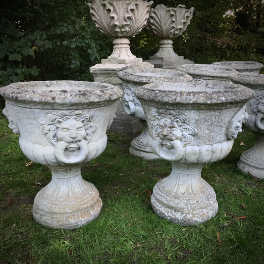 Set of Seven Lion Mask Urns