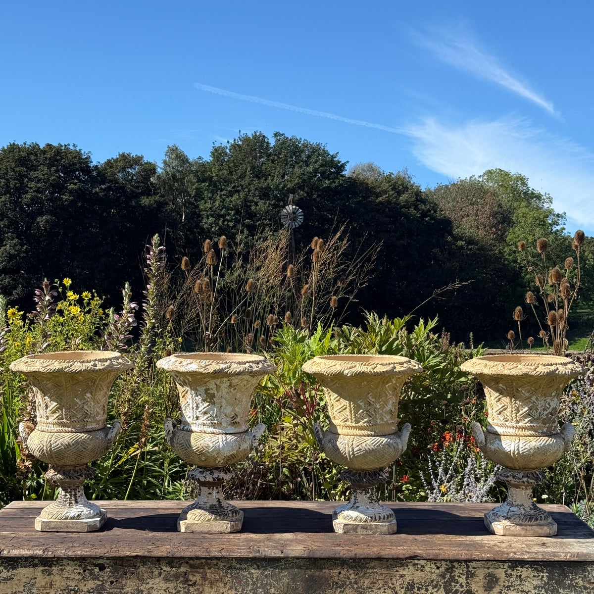 A Set of Four English Buff Terracotta Basket-Weave Garden Urns, c.1860–1880