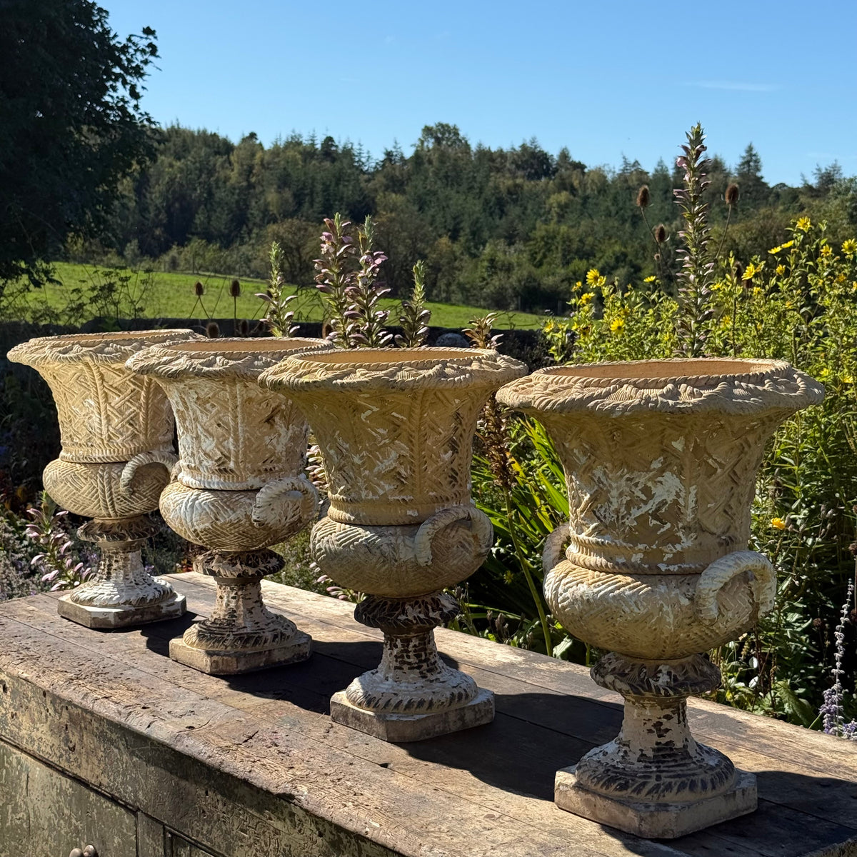 A Set of Four English Buff Terracotta Basket-Weave Garden Urns, c.1860–1880