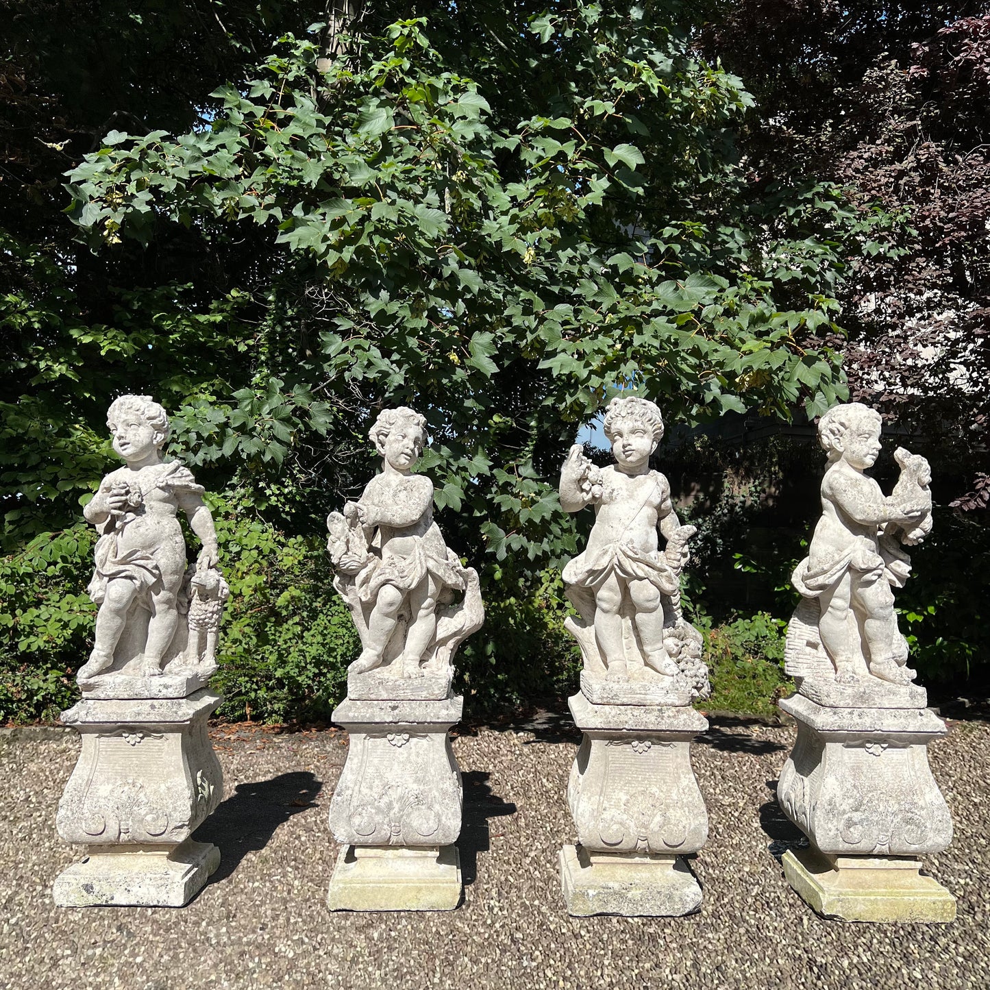 French Limestone Four Seasons Statues with Plinths c. Late 17th/Early 18th Century