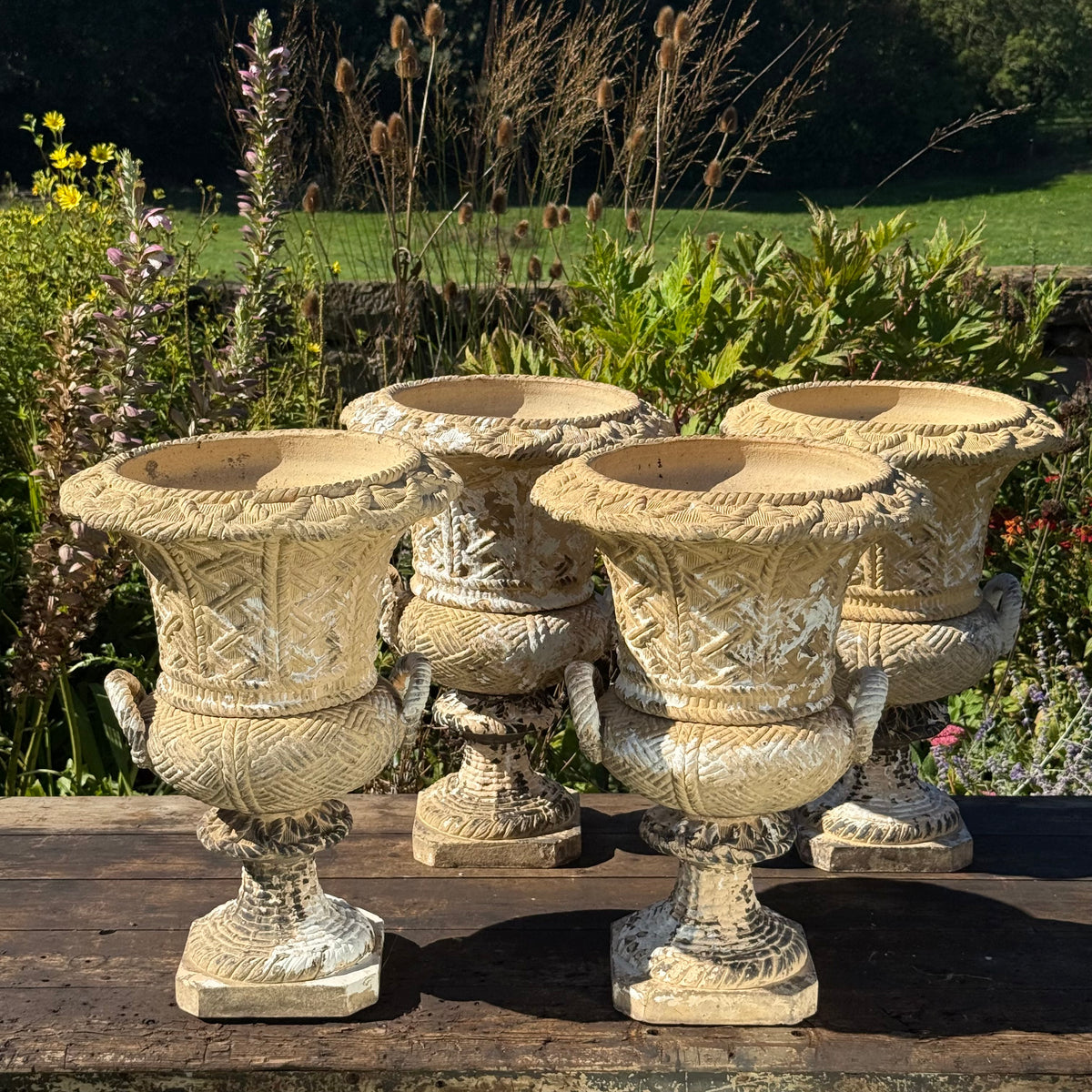 A Set of Four English Buff Terracotta Basket-Weave Garden Urns, c.1860–1880