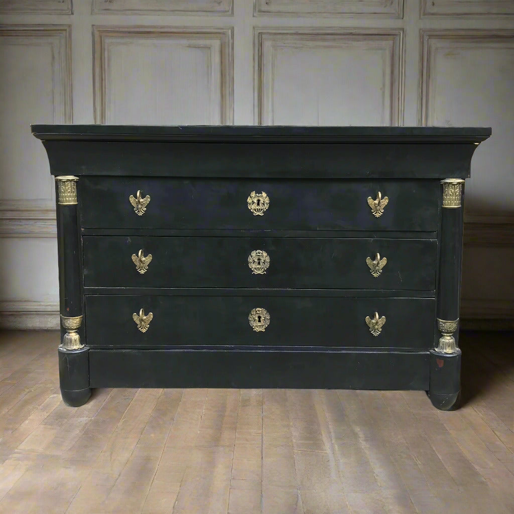 Black dresser with gold accents