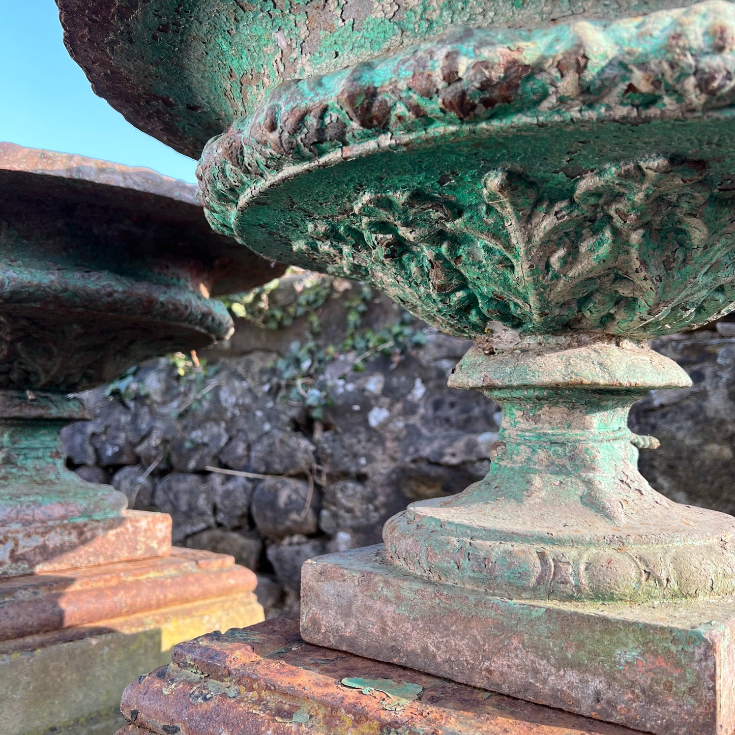 Pair of French Cast Iron Tazza Urns on Sandstone Plinths c.1880