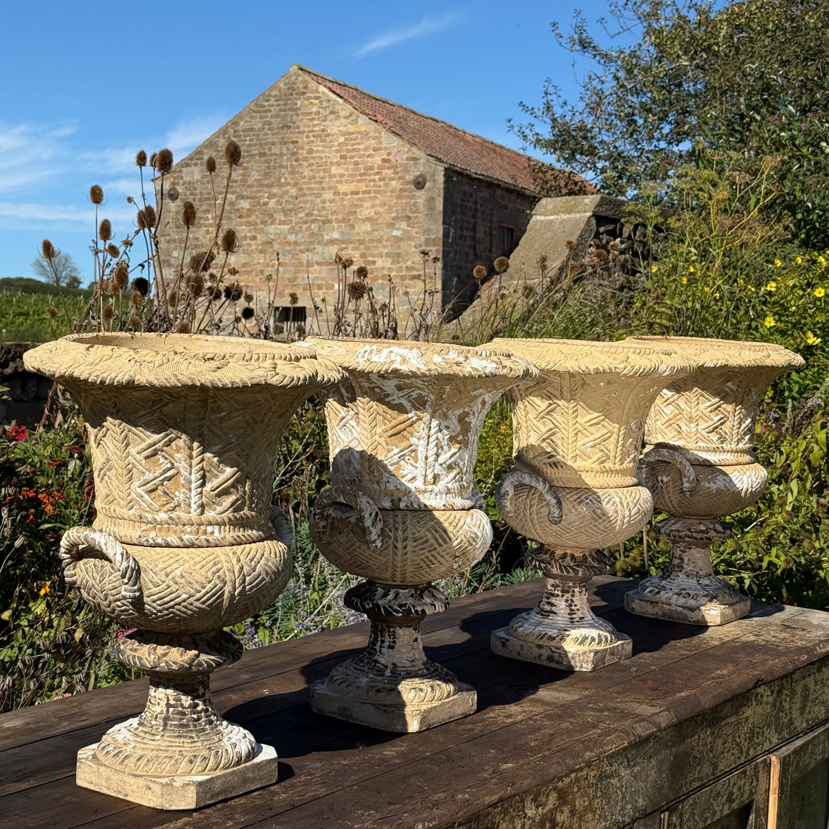 A Set of Four English Buff Terracotta Basket-Weave Garden Urns, c.1860–1880