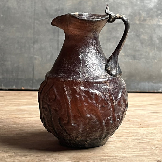 A Roman Aubergine Glass Trefoil-Lipped Jug c. 1st Century A.D.