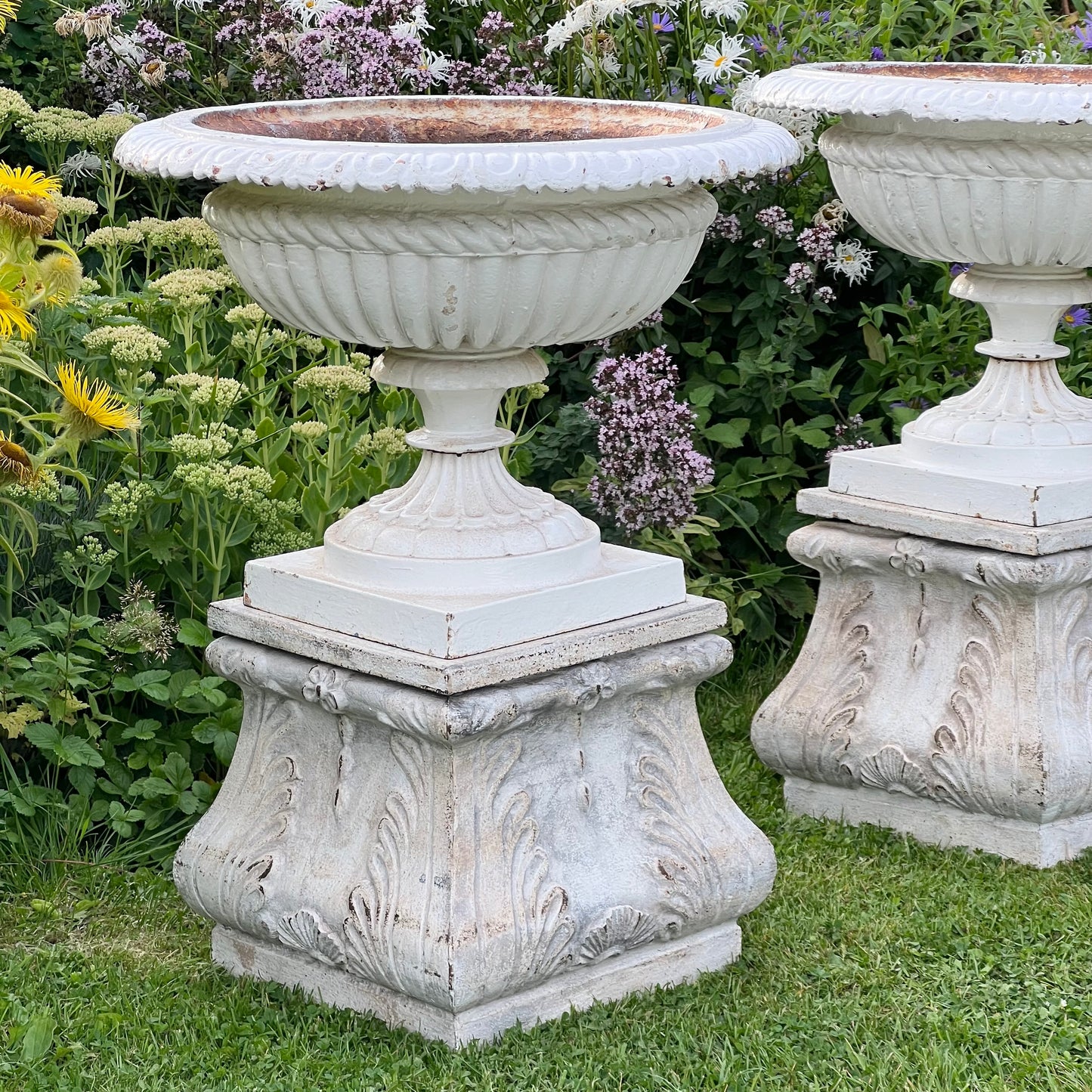 Pair of English Victorian Cast Iron Garden Urns on Ornamented Bases