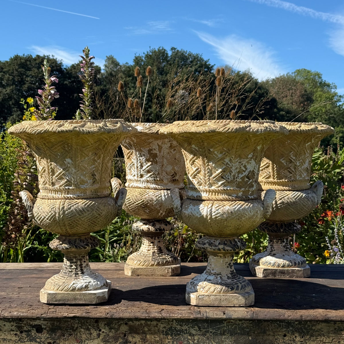 A Set of Four English Buff Terracotta Basket-Weave Garden Urns, c.1860–1880