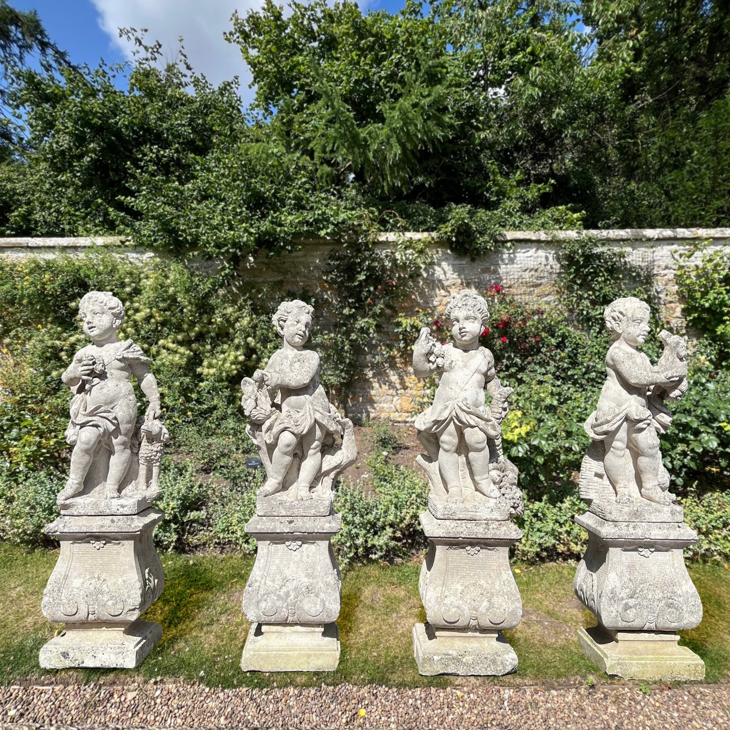 French Limestone Four Seasons Statues with Plinths c. Late 17th/Early 18th Century