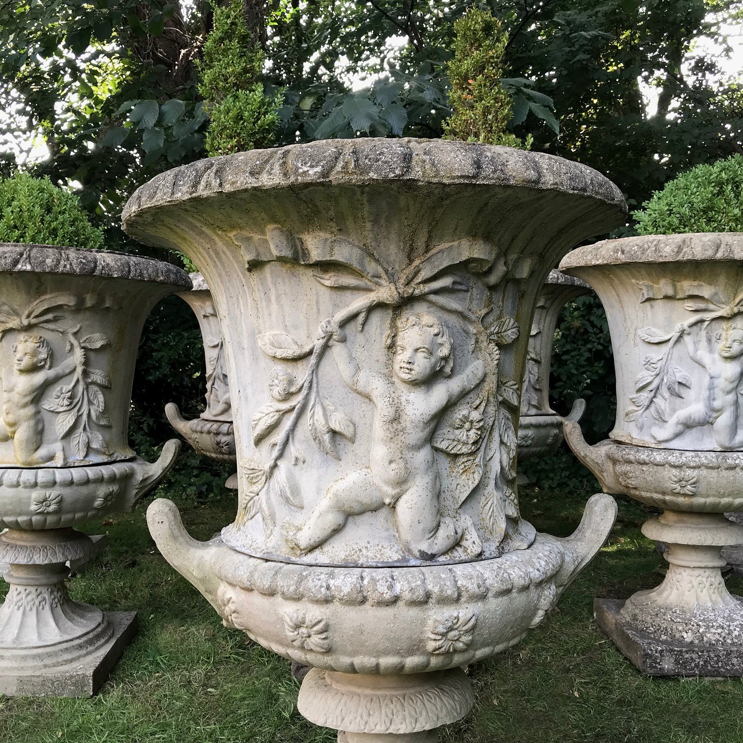 Set of 8 Dancing Putti Campana Urns