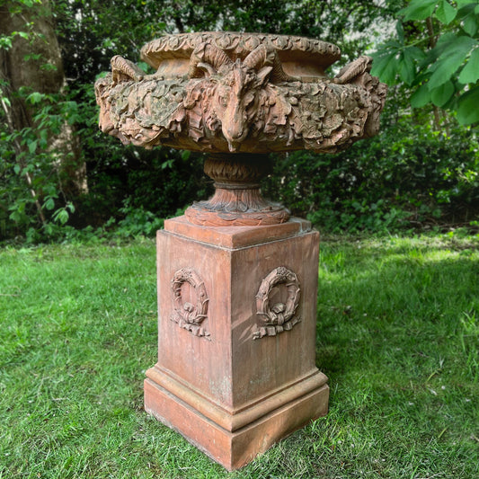 An Italian Neoclassical Style Terracotta Centrepiece Urn with Plinth