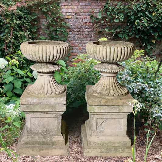 A Pair of Buff Terracotta Urns with Plinths c.1860