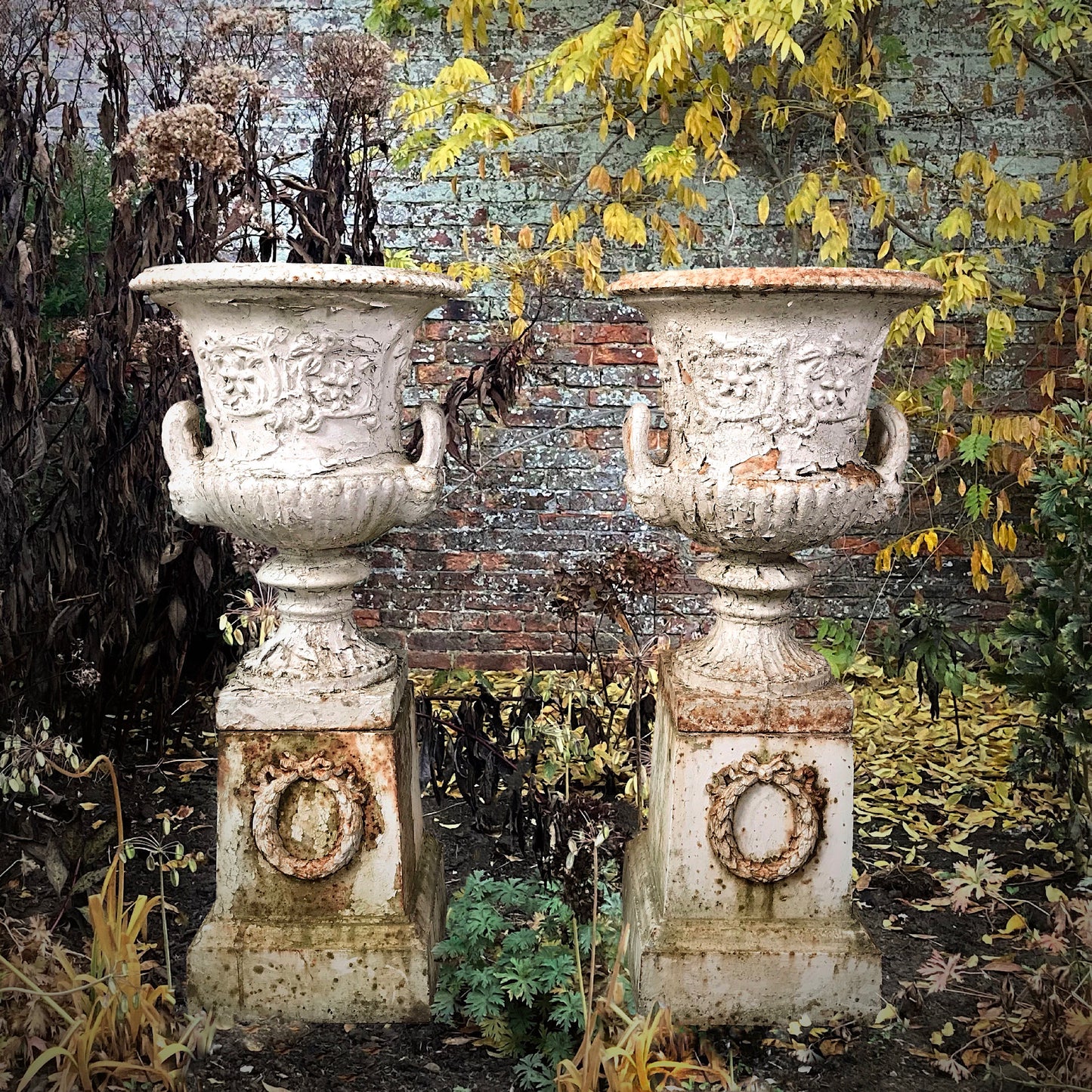 A Pair of Handyside Cast Iron Campana Urns with Plinths c.1870s