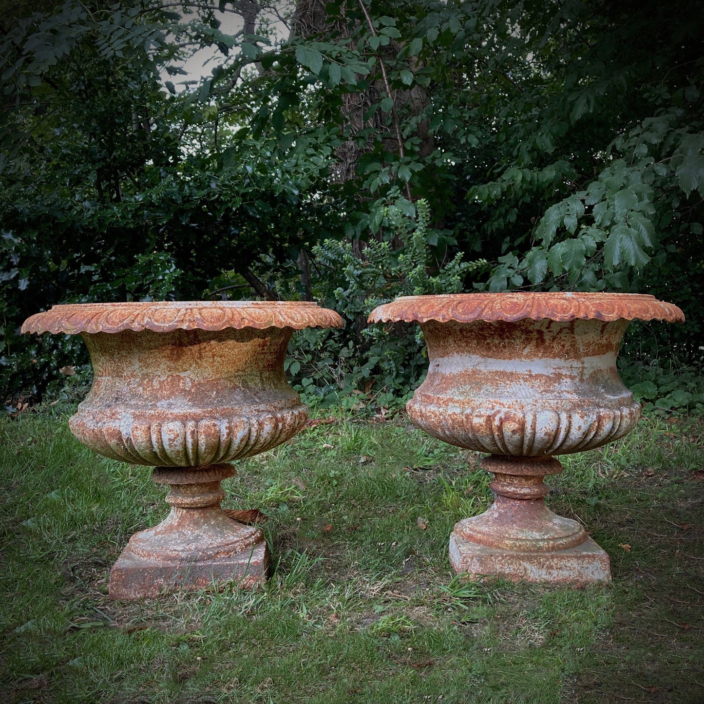 Pair of French Demilune Cast Iron Urns